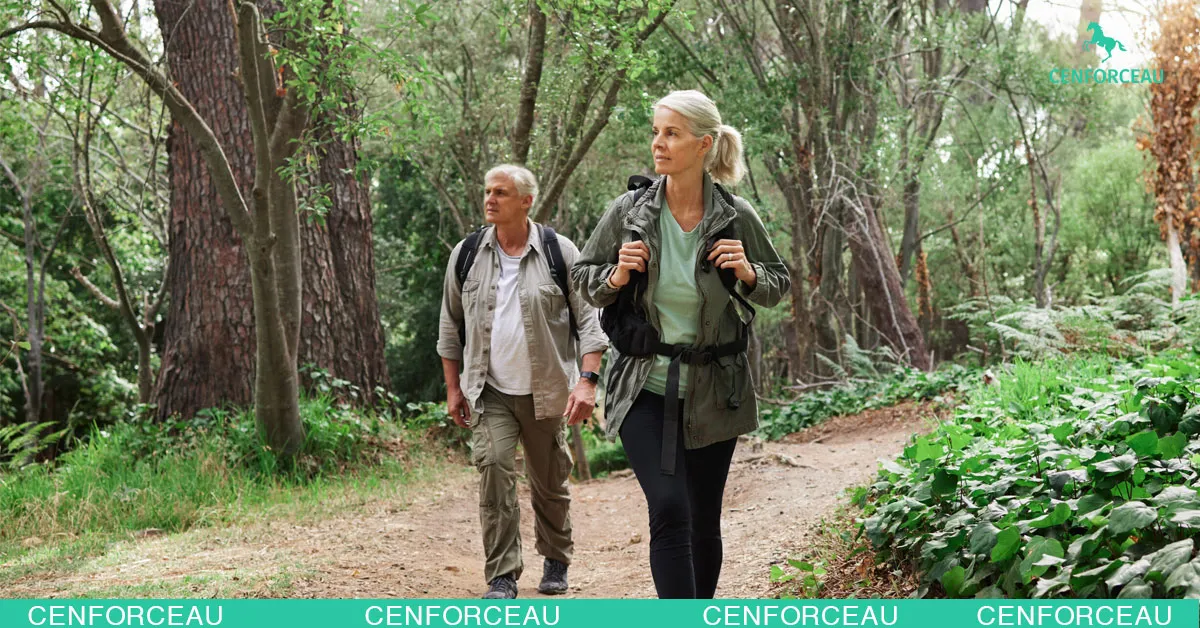 Middle-aged couple enjoying nature walk, symbolizing improved lifestyle and erectile function after ED therapy